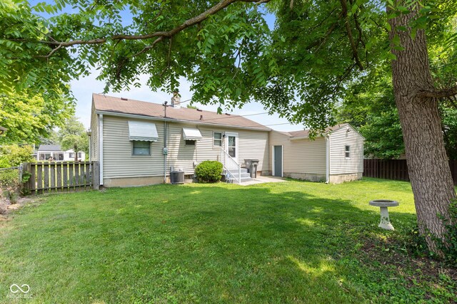 1020 N Ritter Ave, Indianapolis, IN 46219 - rear view of house with entry steps and a fenced backyard