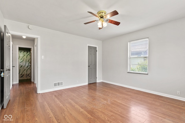 1020 N Ritter Ave, Indianapolis, IN 46219 - unfurnished room with ceiling fan, wood finished floors, and a smoke detector