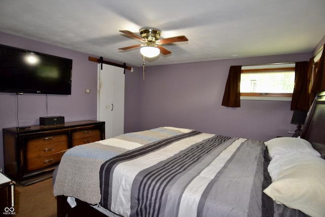7150 Combs Rd, Indianapolis, IN 46237 - bedroom featuring a barn door and ceiling fan
