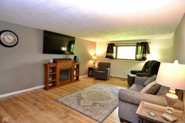 7150 Combs Rd, Indianapolis, IN 46237 - living area featuring wood finished floors and a fireplace