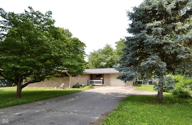 7150 Combs Rd, Indianapolis, IN 46237 - view of front of house with driveway and a front lawn