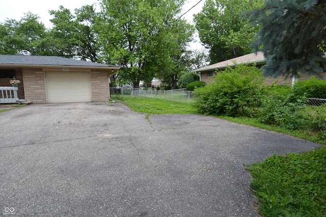 7150 Combs Rd, Indianapolis, IN 46237 - garage featuring driveway