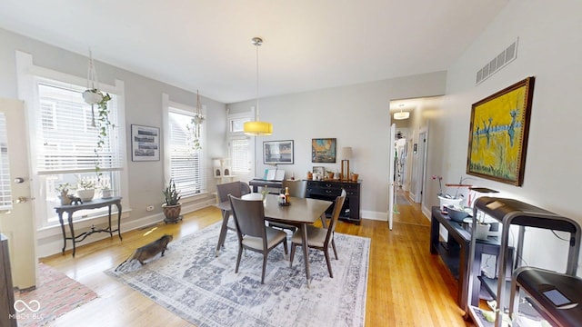 1002 N New Jersey St, Indianapolis, IN 46202 - dining area with light wood-style floors and baseboards