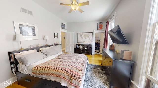 1002 N New Jersey St, Indianapolis, IN 46202 - bedroom with wood finished floors and a ceiling fan