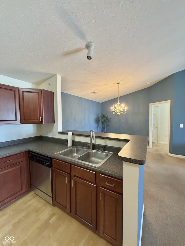 5019 Amber Creek Pl, Indianapolis, IN 46237 - kitchen with dishwasher, dark countertops, a peninsula, a chandelier, and a textured ceiling