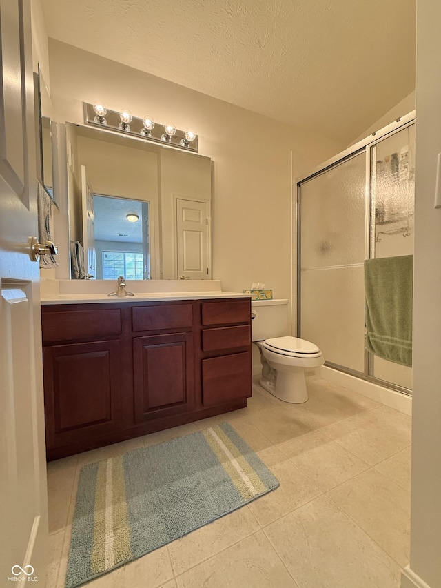 5019 Amber Creek Pl, Indianapolis, IN 46237 - bathroom featuring a stall shower, vanity, tile patterned flooring, a textured ceiling, and lofted ceiling