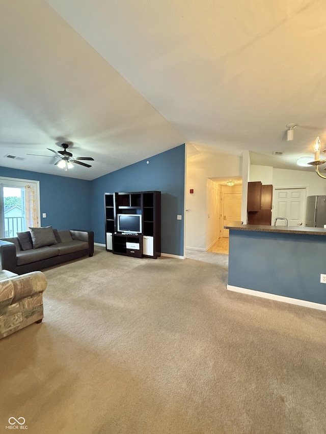 5019 Amber Creek Pl, Indianapolis, IN 46237 - living area featuring light carpet, ceiling fan, and vaulted ceiling