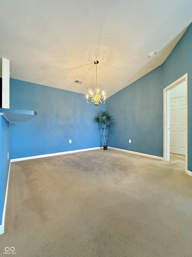 5019 Amber Creek Pl, Indianapolis, IN 46237 - empty room featuring carpet flooring, a chandelier, and lofted ceiling