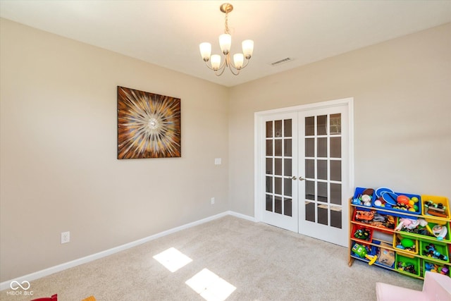 4642 Boyd Pl, Westfield, IN 46062 - rec room with french doors, a chandelier, and carpet flooring
