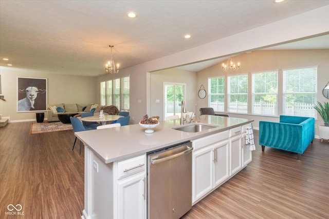 4642 Boyd Pl, Westfield, IN 46062 - kitchen with stainless steel dishwasher, a chandelier, open floor plan, wood finished floors, and recessed lighting