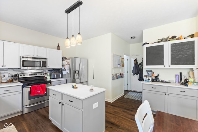 6563 Enclave Blvd, Greenwood, IN 46143 - kitchen with stainless steel appliances, dark wood-style floors, white cabinets, and light countertops