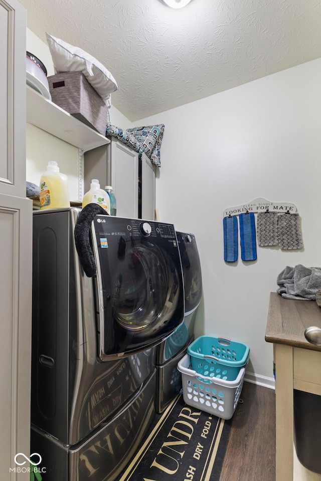 6563 Enclave Blvd, Greenwood, IN 46143 - laundry room featuring independent washer and dryer, wood finished floors, and a textured ceiling