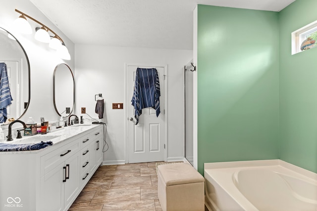 6563 Enclave Blvd, Greenwood, IN 46143 - bathroom featuring double vanity, a garden tub, and a stall shower