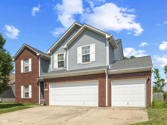 6563 Enclave Blvd, Greenwood, IN 46143 - traditional-style house featuring driveway, brick siding, and a garage