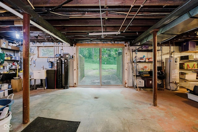 1065 E 76th St, Indianapolis, IN 46240 - below grade area featuring gas water heater and a water softener