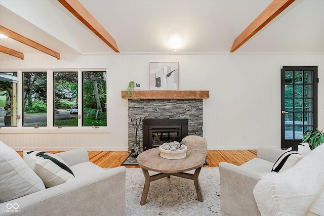 1065 E 76th St, Indianapolis, IN 46240 - living area with beam ceiling, a stone fireplace, wood finished floors, and crown molding