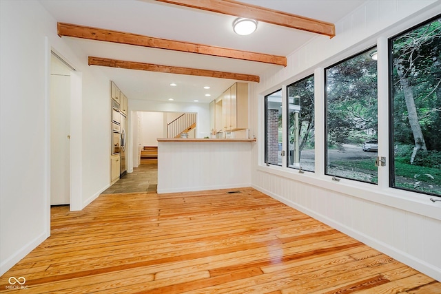 1065 E 76th St, Indianapolis, IN 46240 - unfurnished living room with light wood-style floors, beamed ceiling, stairway, and recessed lighting