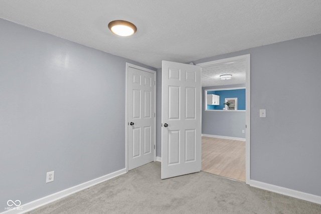 1254 Wade St, Austin, IN 47102 - unfurnished bedroom with a textured ceiling and carpet floors