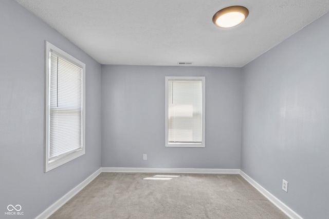 1254 Wade St, Austin, IN 47102 - empty room with light carpet and a textured ceiling