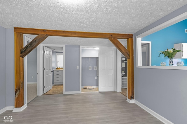 1254 Wade St, Austin, IN 47102 - interior space with wood finished floors and a textured ceiling