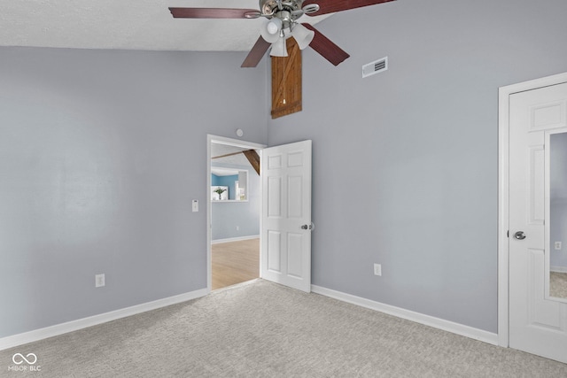 1254 Wade St, Austin, IN 47102 - unfurnished room with ceiling fan, carpet, and high vaulted ceiling