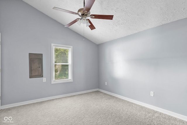 1254 Wade St, Austin, IN 47102 - carpeted spare room featuring electric panel, a ceiling fan, a textured ceiling, and lofted ceiling