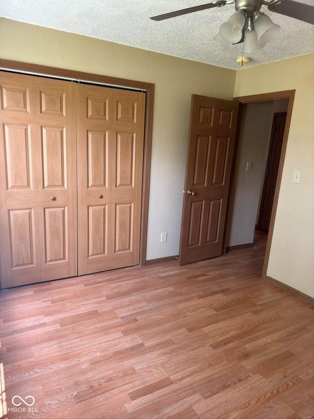 39 Meadow Creek E Boulevard, Whiteland, IN 46184 - unfurnished bedroom with light wood-style floors, a closet, and a ceiling fan