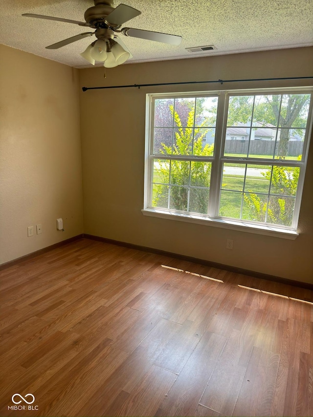 39 Meadow Creek E Boulevard, Whiteland, IN 46184 - spare room featuring ceiling fan, wood finished floors, and a textured ceiling