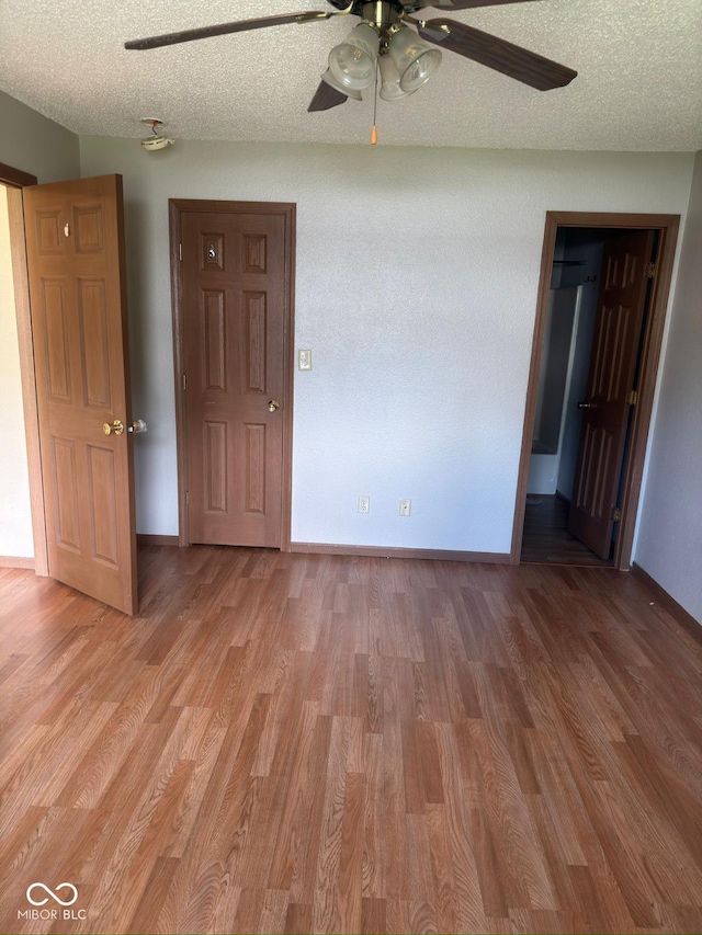 39 Meadow Creek E Boulevard, Whiteland, IN 46184 - empty room featuring ceiling fan, light wood-type flooring, and a textured ceiling