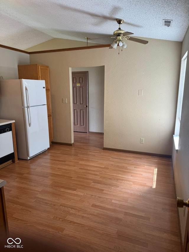 39 Meadow Creek E Boulevard, Whiteland, IN 46184 - kitchen with white appliances, lofted ceiling, ceiling fan, light wood-style flooring, and a textured ceiling