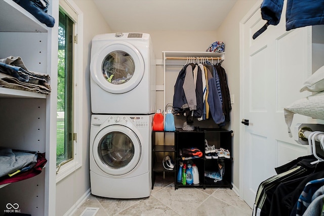 16714 Oak Rd, Westfield, IN 46074 - laundry room featuring stacked washer and clothes dryer and healthy amount of natural light
