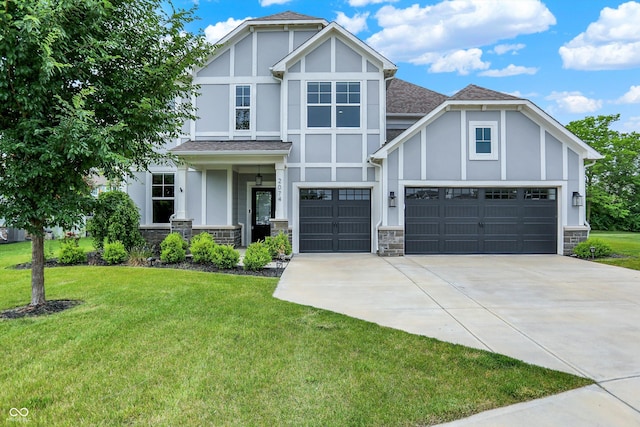 2074 Tompkins Dr, Westfield, IN 46074 - tudor-style house featuring concrete driveway, a front lawn, and stone siding