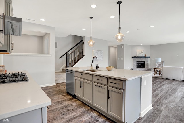 2074 Tompkins Dr, Westfield, IN 46074 - kitchen with appliances with stainless steel finishes, gray cabinetry, dark wood-type flooring, and recessed lighting