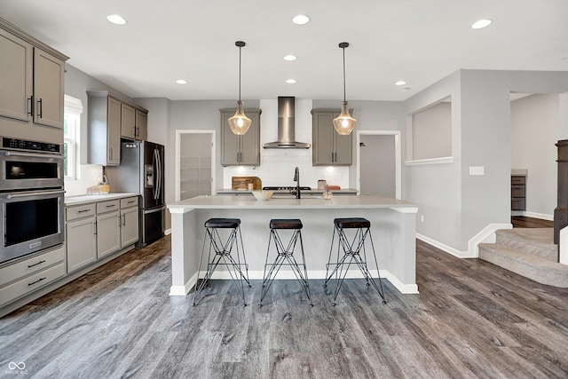 2074 Tompkins Dr, Westfield, IN 46074 - kitchen featuring wall chimney exhaust hood, black fridge with ice dispenser, gray cabinetry, stainless steel double oven, and light countertops