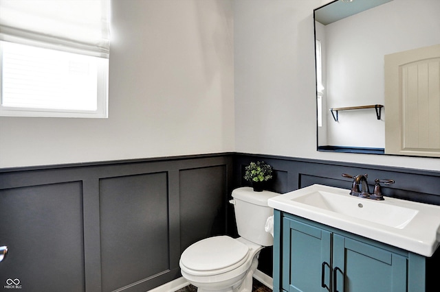 2074 Tompkins Dr, Westfield, IN 46074 - half bathroom with vanity, a decorative wall, and wainscoting