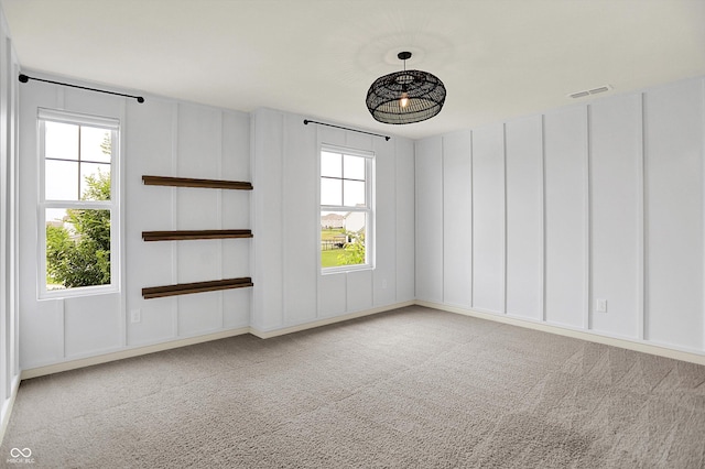 2074 Tompkins Dr, Westfield, IN 46074 - unfurnished room with carpet and a decorative wall