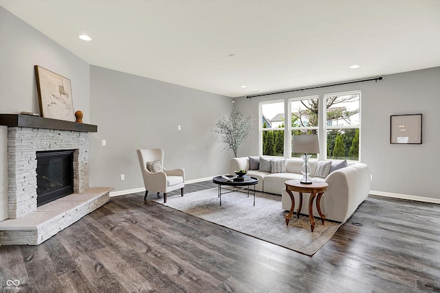 2074 Tompkins Dr, Westfield, IN 46074 - living area featuring wood finished floors, a stone fireplace, and recessed lighting
