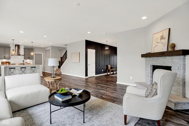 2074 Tompkins Dr, Westfield, IN 46074 - living room featuring dark wood-type flooring, recessed lighting, stairway, and a fireplace