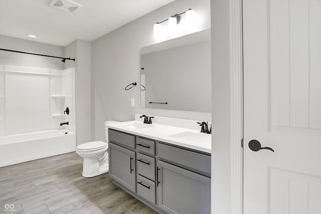 2074 Tompkins Dr, Westfield, IN 46074 - bathroom featuring double vanity, washtub / shower combination, and wood finished floors