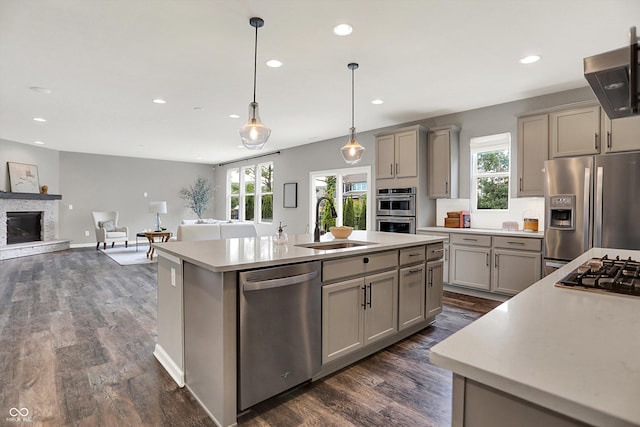 2074 Tompkins Dr, Westfield, IN 46074 - kitchen with appliances with stainless steel finishes, gray cabinets, extractor fan, a center island with sink, and recessed lighting