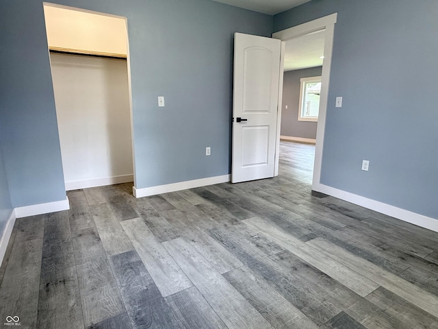 1818 Broadway St, Anderson, IN 46012 - unfurnished bedroom featuring dark wood-style floors and baseboards