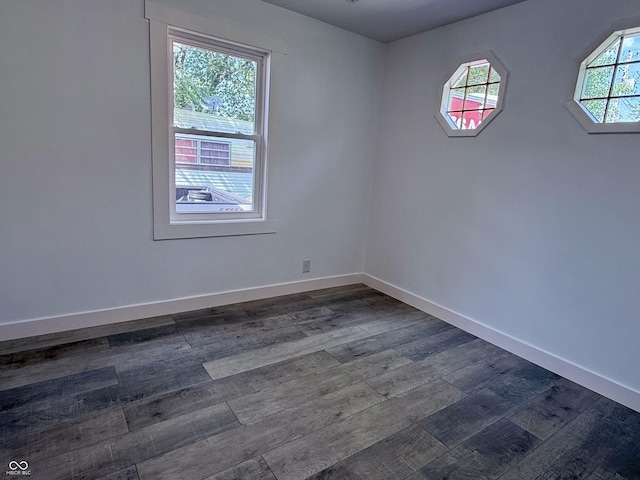1818 Broadway St, Anderson, IN 46012 - spare room with dark wood-style floors and baseboards