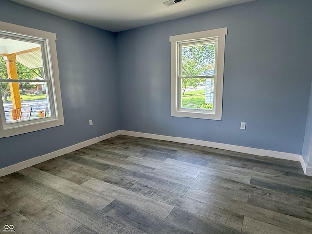 1818 Broadway St, Anderson, IN 46012 - spare room featuring dark wood-type flooring and baseboards