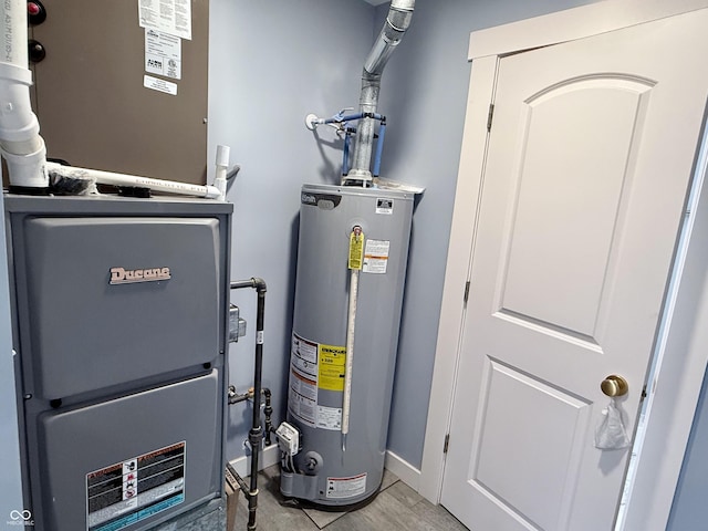 1818 Broadway St, Anderson, IN 46012 - utility room featuring water heater and heating unit