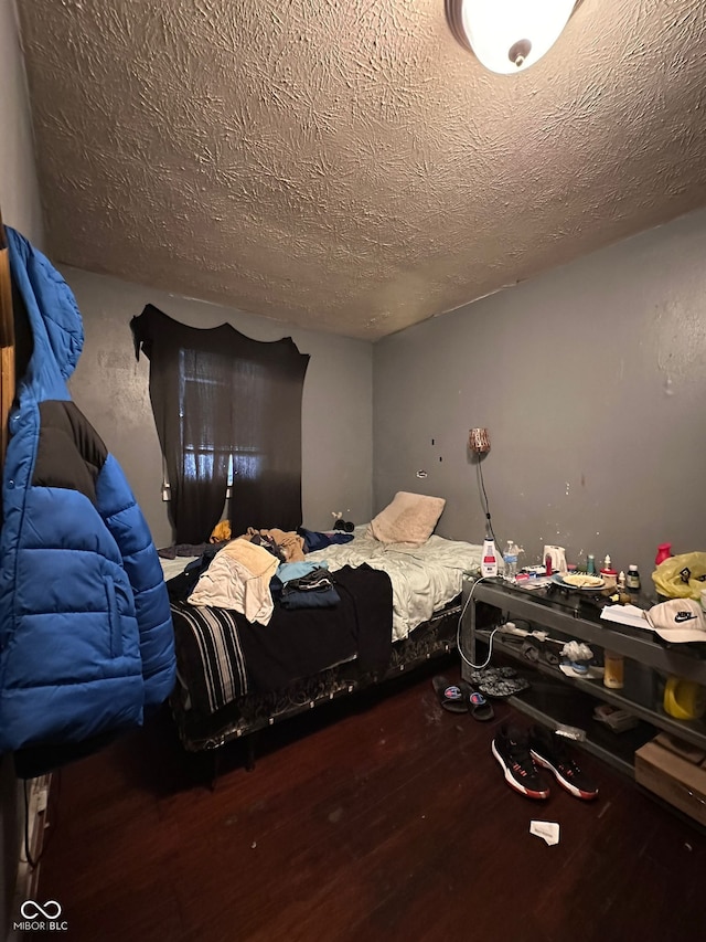 1129 N Pershing Ave, Indianapolis, IN 46222 - bedroom featuring wood finished floors and a textured ceiling
