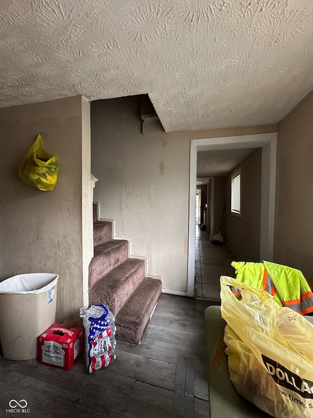 1129 N Pershing Ave, Indianapolis, IN 46222 - staircase with a textured ceiling and wood finished floors