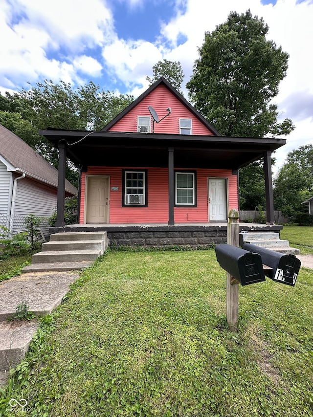 1129 N Pershing Ave, Indianapolis, IN 46222 - bungalow featuring a porch and a front yard