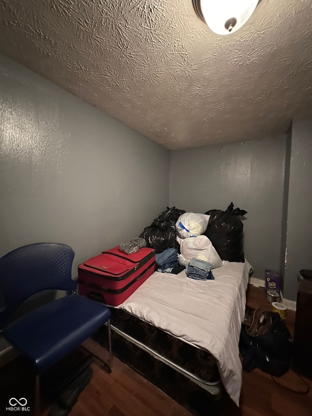 1129 N Pershing Ave, Indianapolis, IN 46222 - bedroom with wood finished floors and a textured ceiling