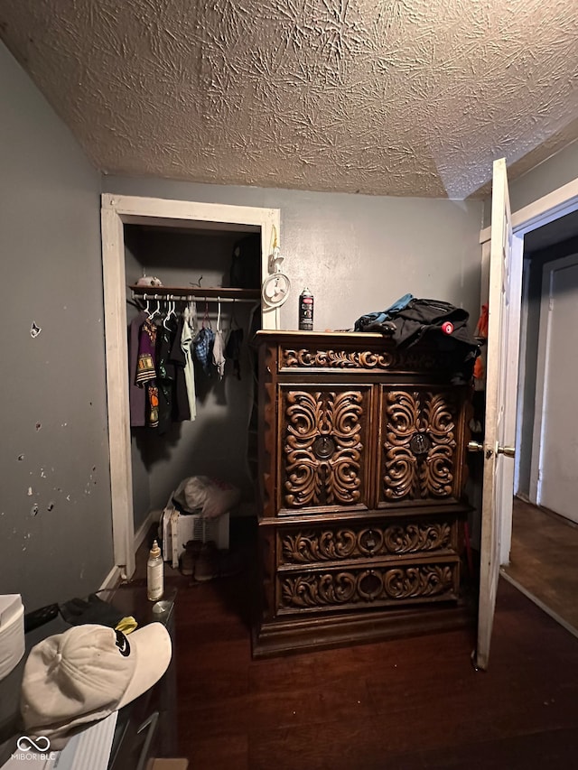 1129 N Pershing Ave, Indianapolis, IN 46222 - bedroom with a closet, wood finished floors, and a textured ceiling