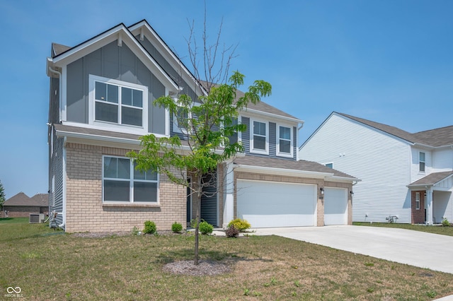 7510 Hillway Dr, Camby, IN 46113 - view of front of home featuring brick siding, concrete driveway, a front yard, and board and batten siding